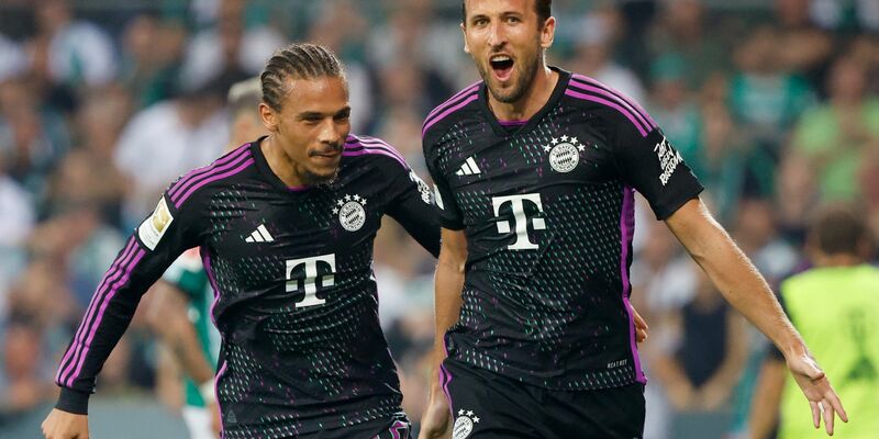 Zwei wichtige Spieler für den FC Bayern: Leroy Sané (l) und Harry Kane. - Foto: Axel Heimken/dpa