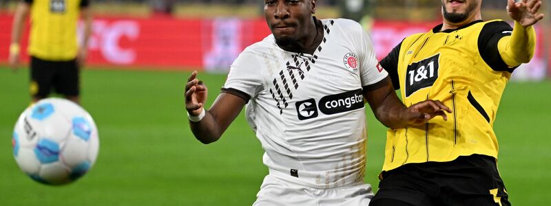 Der Kanzler bekommt einen BVB-Sieg zu sehen.  - Foto: Bernd Thissen/dpa