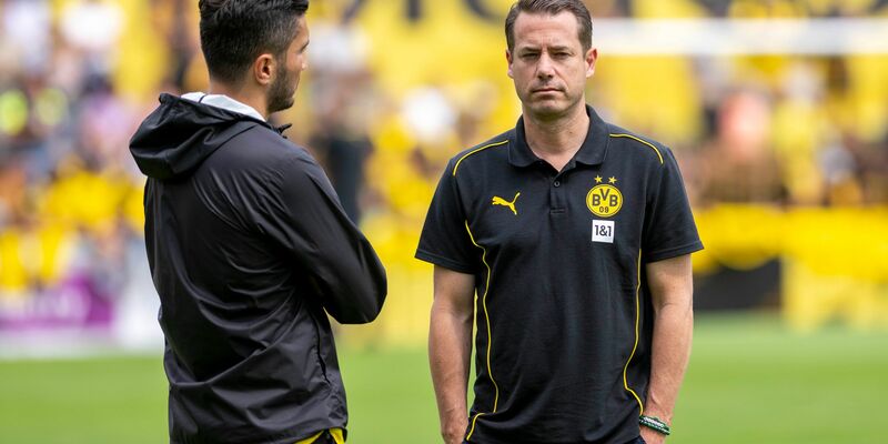 BVB-Boss Lars Ricken diskutiert nicht über Trainer Nuri Sahin (links) - Foto: David Inderlied/dpa