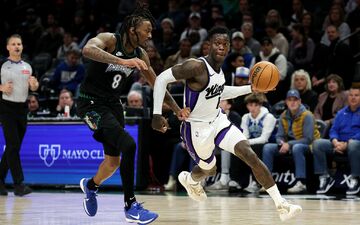 Dennis Schröder (r) erzielte 17 Punkte für die Kings, zum Sieg in Minnesota reichte es aber nicht.  - Foto: Matt Krohn/AP/dpa