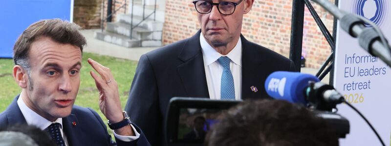 Betonen vor dem EU-Gipfel ihre Einigkeit: Macron und Merz.  - Foto: Francois Walschaerts/AP/dpa