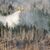 Ein italienisches Löschflugzeug bekämpft einen Waldbrand am Brocken. - Foto: Julian Stratenschulte/dpa