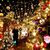 Dirk van Acken steht vor seinem festlichen, mit weit über 10.000 Lichtern dekorierten Weihnachtshaus. - Foto: Roland Weihrauch/dpa