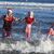 Eine Gruppe junger Frauen in Weihnachtskostümen planscht während des jährlichen Weihnachtsschwimmens am Long Sands Beach. - Foto: Owen Humphreys/PA Wire/dpa