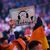 «Heute keine Kopfhörer»: Ein Fan hält in Anspielung auf den Auftritt von Gerwyn Price am Vorabend ein Schild hoch. - Foto: Zac Goodwin/PA Wire/dpa