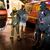 Ein Mann wird von einem Beamten des Spezialeinsatzkommandos mit Schutzmaske in Gewahrsam genommen. - Foto: Karsten Wickern/dpa