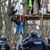 Eine vermummte Person steht im Fechenheimer Wald der Polizei gegenüber. - Foto: Hannes P Albert/dpa