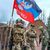 Denis Puschilin, Chef der teils von Russland besetzten Region Donezk, mit einer Fahne der russisch kontrollierten Region Donezk in Bachmut. - Foto: -/Denis Pushilin, head of the Russian-controlled Donetsk region telegram channel/AP/dpa
