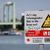 Ein Schild am Rheinufer weist auf die Gefahren beim Schwimmen im Fluss hin. - Foto: Rolf Vennenbernd/dpa