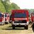 In Göldenitz in Mecklenburg-Vorpommern stehen Fahrzeuge für den weiteren Einsatz gegen den Wald- und Moorbrand bereit. - Foto: Bernd Wüstneck/dpa
