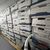 Kisten mit Unterlagen stehen in einem Lagerraum im Anwesen Mar-a-Lago des ehemaligen US-Präsidenten Trump. - Foto: Uncredited/Justice Department/AP/dpa