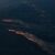 Von einem Flugzeug aus sind die Waldbrände auf der Insel Rhodos zu sehen. - Foto: Britta Pedersen/dpa