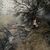 Ein Mann geht an einem Haus vorbei, das bei einem Waldbrand in der algerischen Provinz Bouira niedergebrannt ist. - Foto: XinHua/dpa