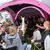 Metal-Fans aus Kiel feiern auf einem Zeltplatz auf dem vom Regen aufgeweichten Festivalgelände. - Foto: Christian Charisius/dpa