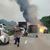 Autofahrer verlassen ihre Fahrzeuge, während im Hintergrund ein Lkw in Flammen steht. Nach einem Auffahrunfall sind auf einem Gefahrguttransporter mehrere Gasflaschen explodiert. - Foto: -/TNN/dpa