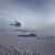 Zwei Hubschrauber erreichen die Forschungsstation Casey in der Antarktis. - Foto: Duncan Logan/Australian Antarctic Division/dpa