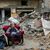 Ein palästinensischer Mann sitzt in einem Sessel vor einem zerstörten Gebäude in Gaza-Stadt. - Foto: Mohammed Hajjar/AP/dpa