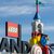 Neben dem Logo am Eingang zum Legoland ist eine Achterbahn zu sehen. - Foto: Stefan Puchner/dpa