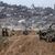Israelische Armeefahrzeuge und Soldaten sind in der Nähe der Grenze zum Gazastreifen zu sehen. - Foto: Tsafrir Abayov/AP/dpa