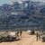 Israelische Soldaten beziehen in der Nähe der Grenze zum Gazastreifen Stellung. - Foto: Ariel Schalit/AP/dpa