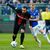 Darmstadt bemüht sich gegen Leverkusen: Fabian Holland (r.) im Duell gegen Leverkusens Borja Iglesias. - Foto: Uwe Anspach/dpa