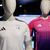 Wurde kontrovers diskutiert: die Farbwahl des neuen Pink und lilafarbenen Auswärtstrikots der deutschen Fußballnationalmannschaft (r). - Foto: Daniel Karmann/dpa