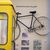 Eine Telefonzelle und Ausstellungsstücke wie das Fahrrad von Kaufhaus-Erpresser Dagobert in der Polizeihistorischen Sammlung der Polizei Berlin. - Foto: Sebastian Gollnow/dpa