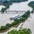 Zwei Schiffe liegen im Hochwasser der Donau. - Foto: Armin Weigel/dpa