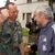 DFB-Teamchef Rudi Völler (r) wird beim Besuch bei den deutschen Soldaten der SFOR-Truppe im Feldlager Raijlovac in Sarajevo von Oberst Gerhard Stelz begrüßt. - Foto: Achim Scheidemann/dpa