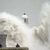 In der Strandpromenade in Porthcawl in Wales gab es bereits am Samstag große Wellen. - Foto: Ben Birchall/PA Wire/dpa