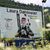 Ein Plakat erinnert unweit von Garmisch-Partenkirchen an die Erfolge Laura Dahlmeiers. - Foto: Str/dpa