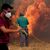 Unermüdlich kämpfen Einsatzkräfte und freiwillige Helfer gegen die Flammen. - Foto: Pablo Garcia/AP/dpa