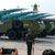 Während einer Militärparade ziehen Raketen vorbei. - Foto: Ng Han Guan/AP/dpa