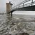 An der Alten Liebe überschwemmt die Nordsee bei einer Sturmflut das Hafengebiet. - Foto: Christian Butt/dpa